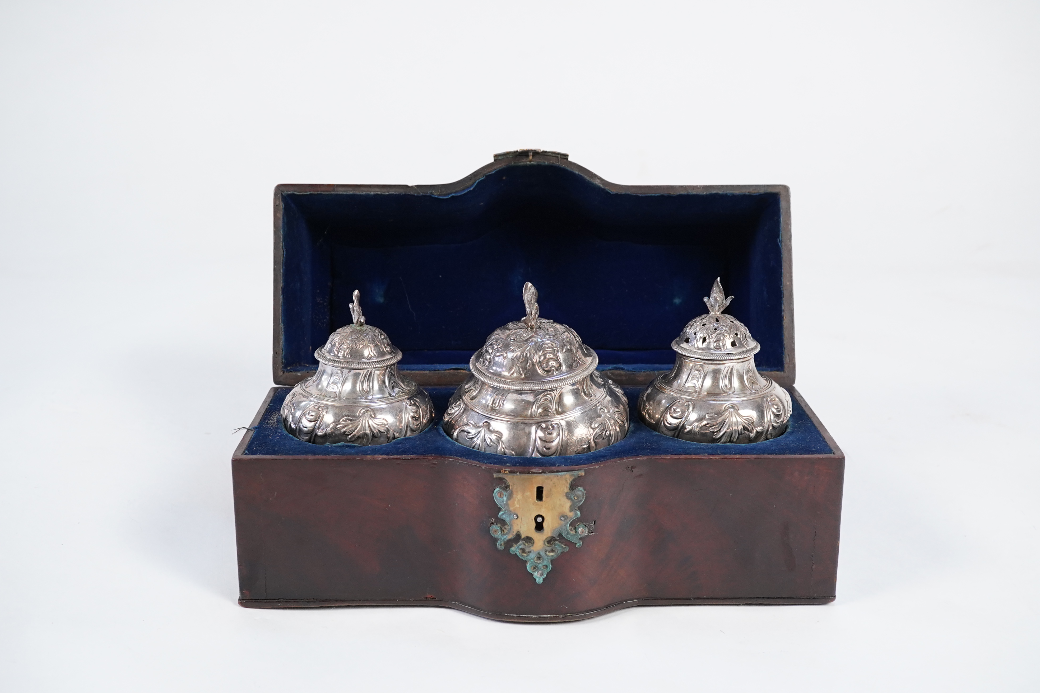 A George II mahogany cased set of two early George III silver tea caddies and covers and a sugar vase and cover, by Samuel Herbert & Co